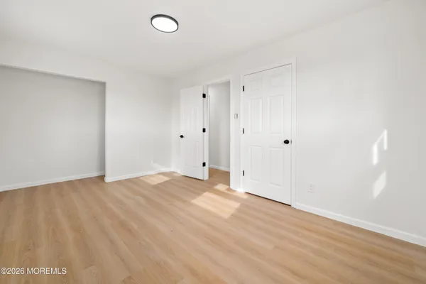 a kitchen with cabinets stainless steel appliances and a counter space