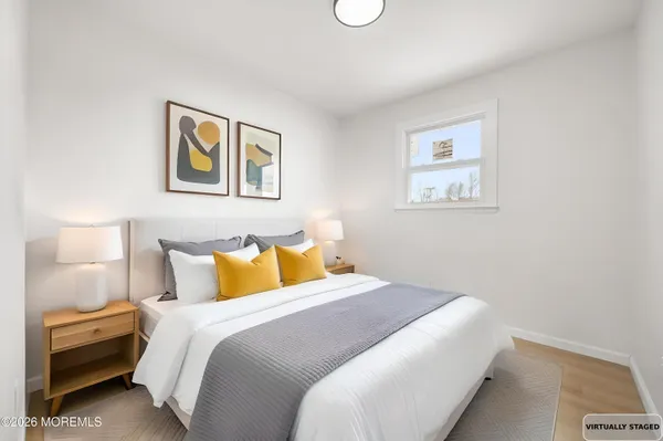 a bed room with a bed and a night stand