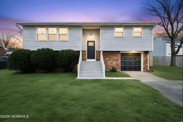 a view of a house with a yard