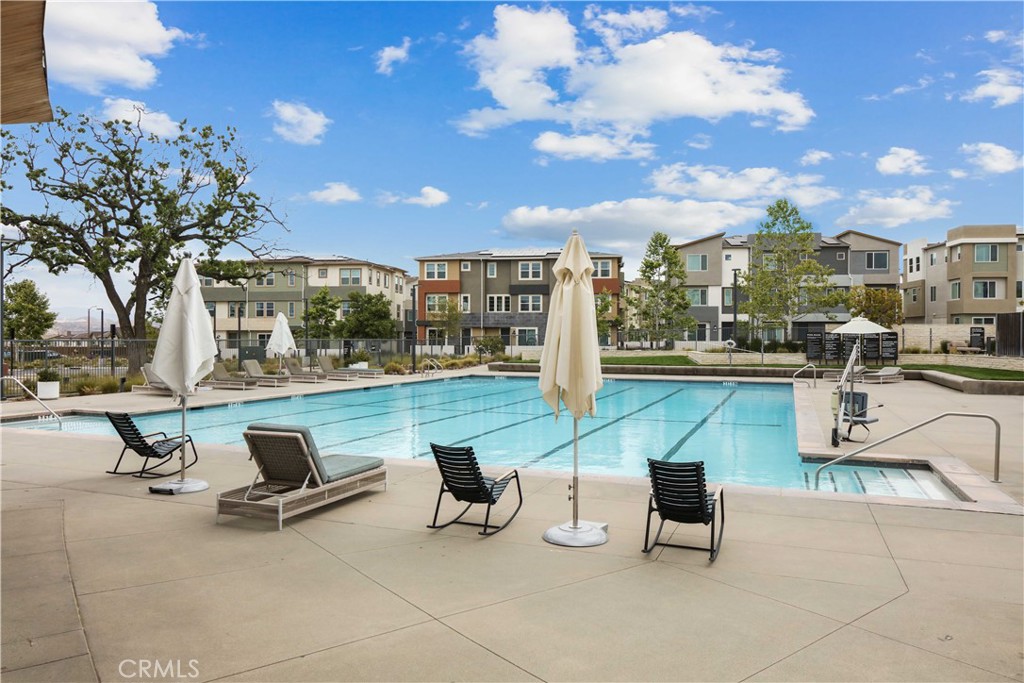 a view of a patio with swimming pool