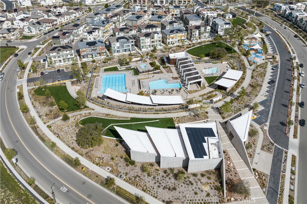 26973 West Prospector Road, Unit 302 Valencia, CA 91381 - Photo 17 of 22 a view of swimming pool with a dining table