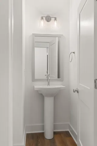 a bathroom with a sink and mirror