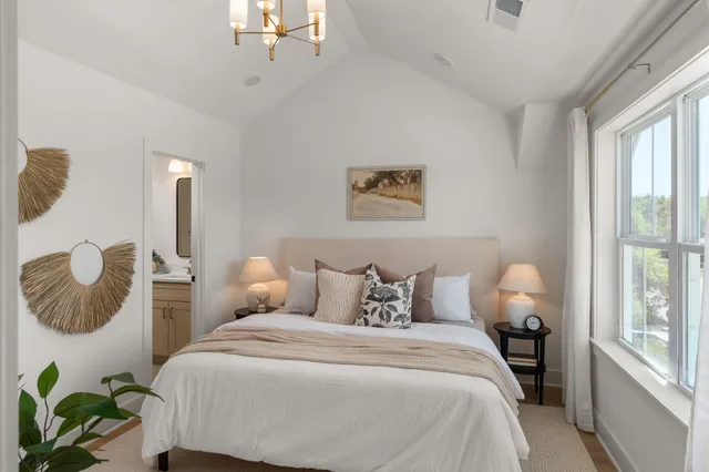 a bedroom with bed and window