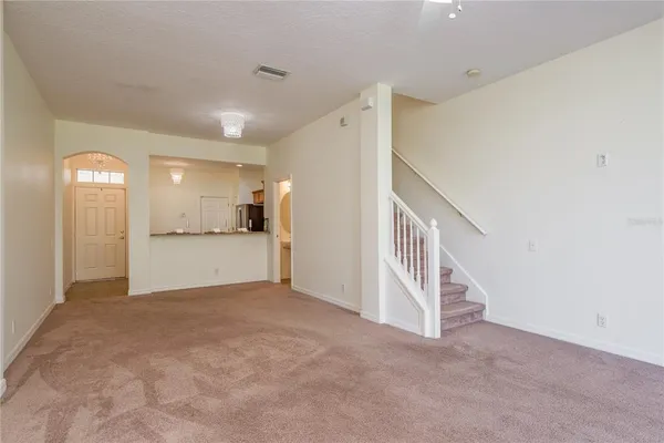 a living room with furniture and a rug
