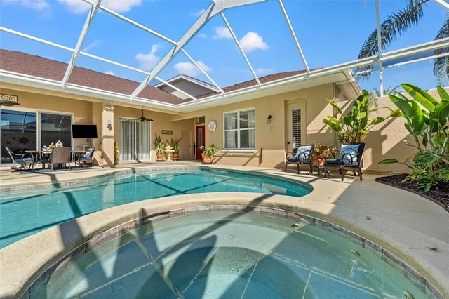 a kitchen with stainless steel appliances granite countertop a refrigerator sink and stove