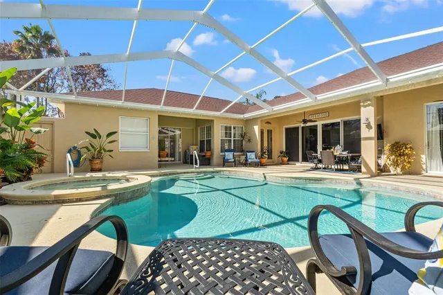 a kitchen with kitchen island granite countertop a stove sink and cabinets