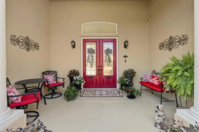 an aerial view of house with yard swimming pool and outdoor seating