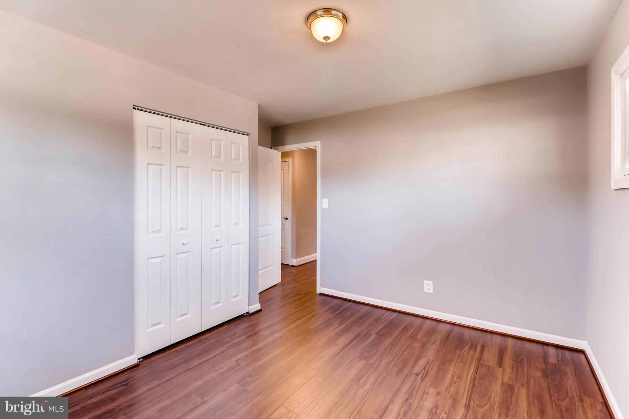 7508 Marston Road Baltimore, MD 21207 - Photo 14 of 18 a view of an empty room with wooden floor