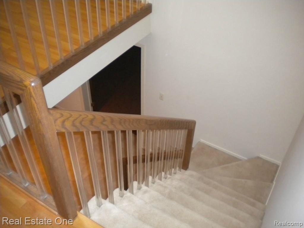 36615 Valley Ridge Drive Farmington, MI 48331 - Photo 27 of 51 Custom stairs lead to study area and huge oversize basement!