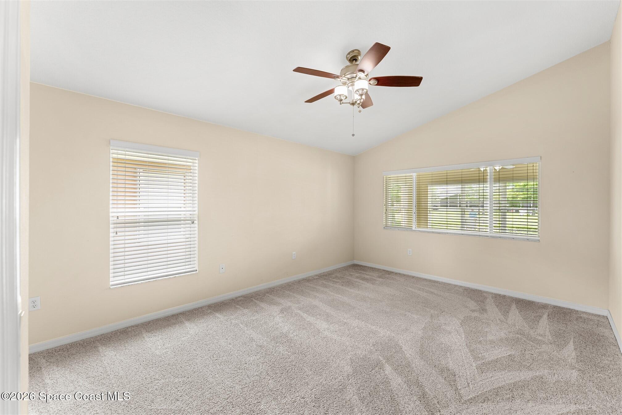 6904 Renshaw Drive Melbourne, FL 32940 - Photo 20 of 46 a view of an empty room with a window