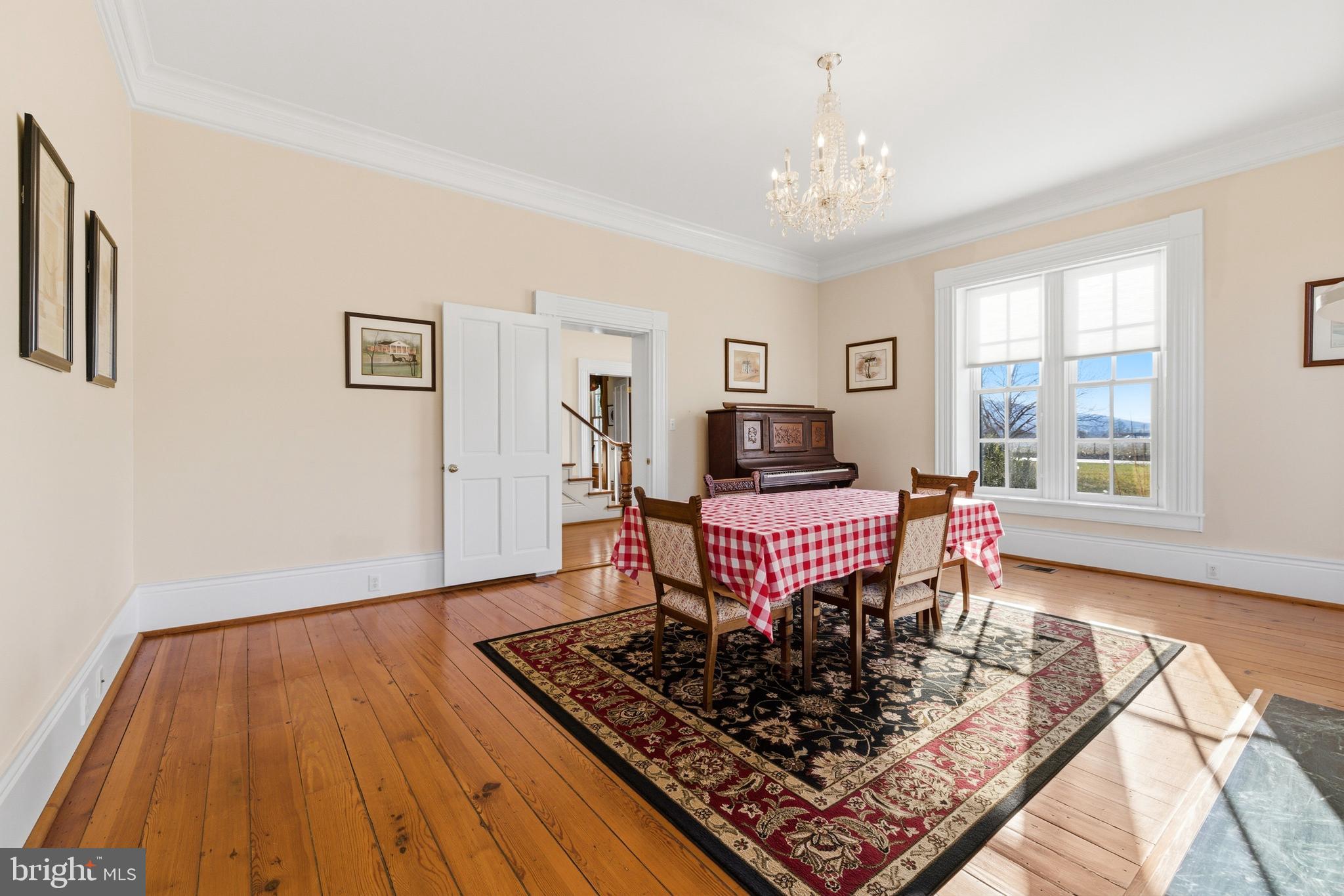 5329 Farmview Road Stanley, VA 22851 - Photo 11 of 111 a living room with a couch and a chandelier