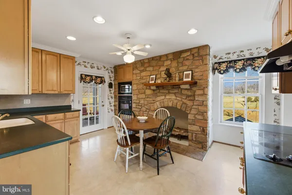 a view of kitchen with sink and cabinets