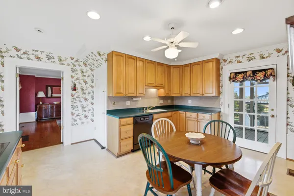 a dining room with furniture and wooden floor