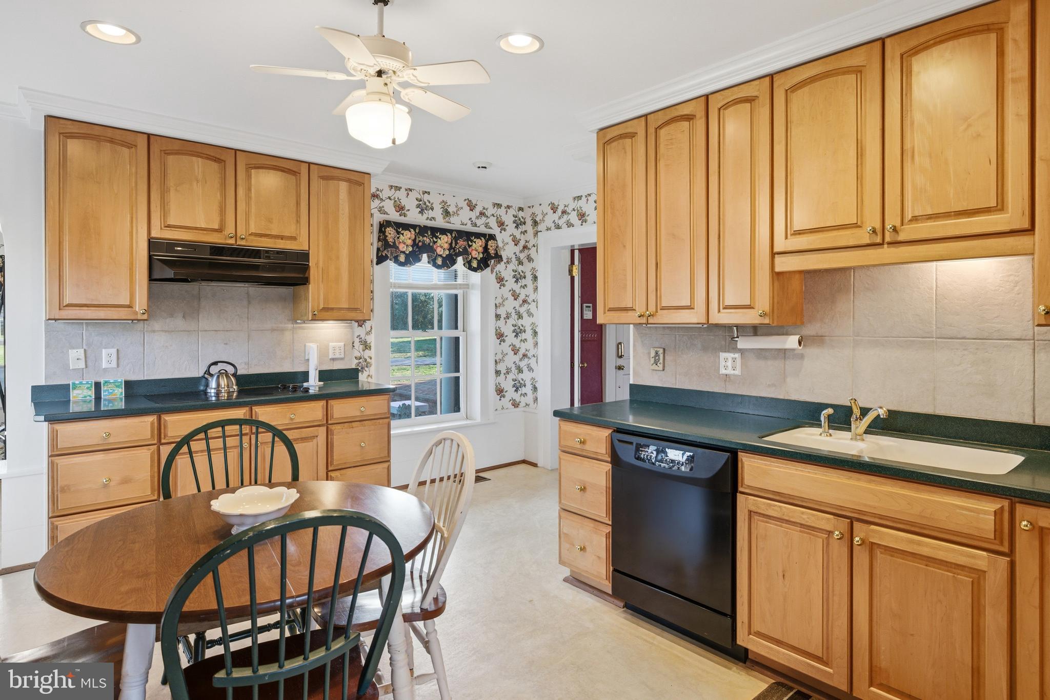 5329 Farmview Road Stanley, VA 22851 - Photo 14 of 111 a kitchen with stainless steel appliances granite countertop a sink a stove a refrigerator cabinets and dining table