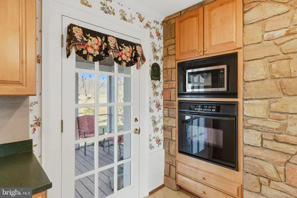 a living room with furniture a fireplace and a window