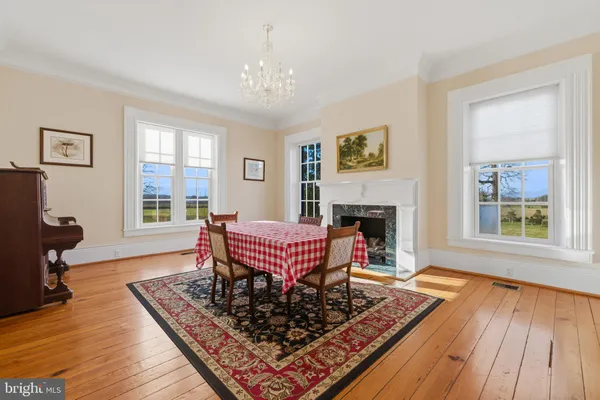 a view of a room with wooden floor and stairs