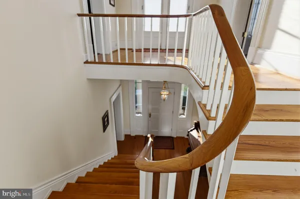 a bathroom with a sink toilet and a mirror