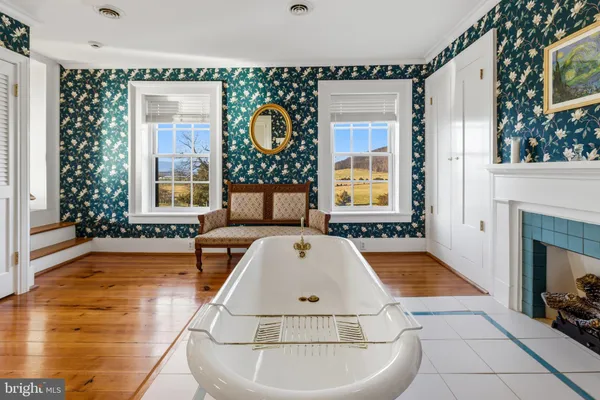 a view of a house with backyard porch and sitting area