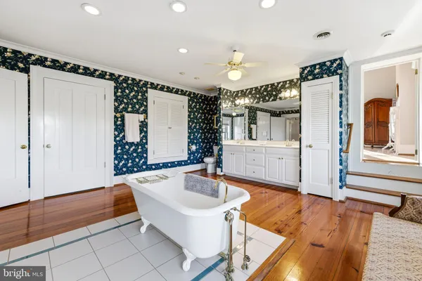 a view of house with backyard and garden