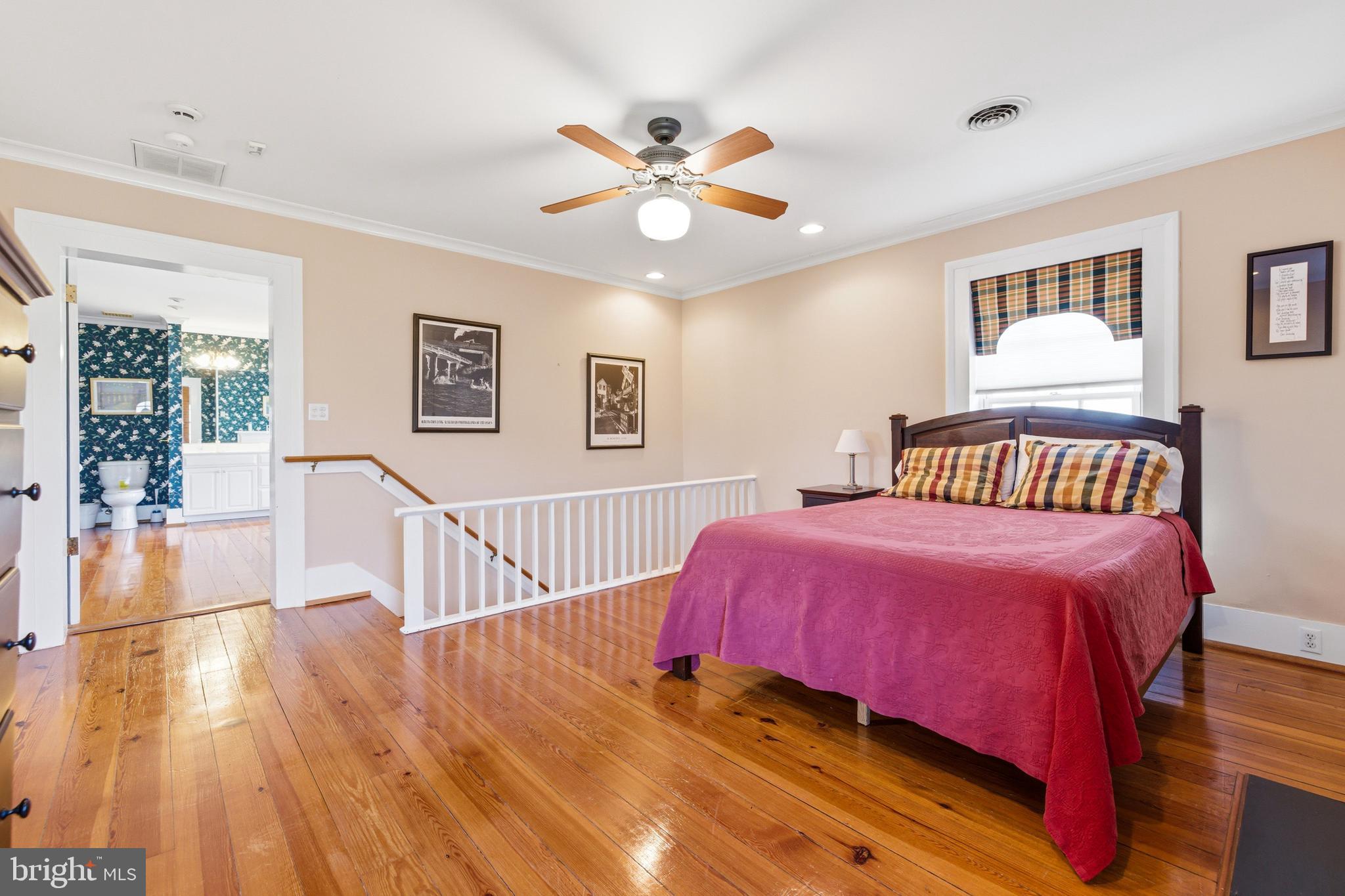 5329 Farmview Road Stanley, VA 22851 - Photo 47 of 111 a bedroom with a bed and a chandelier