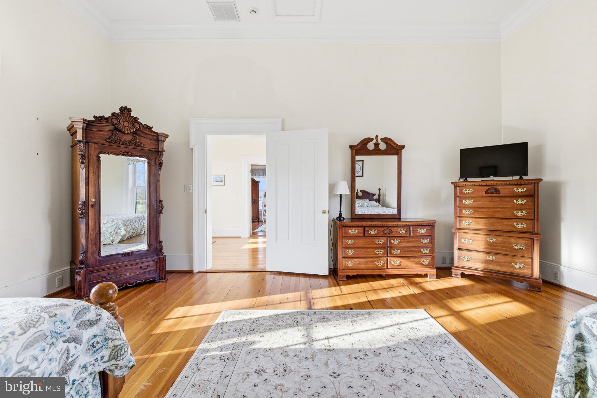 5329 Farmview Road Stanley, VA 22851 - Photo 51 of 111 a bedroom with a bed and wooden floor