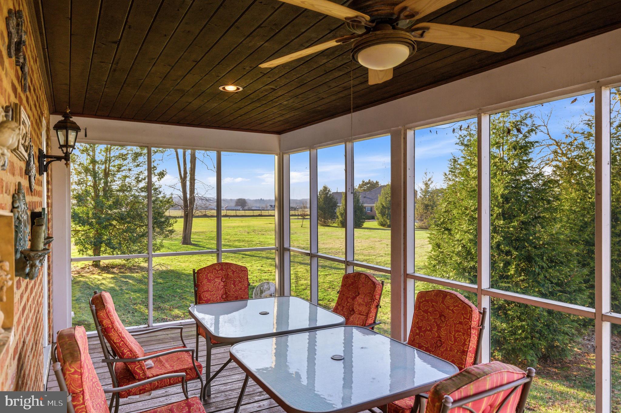 5329 Farmview Road Stanley, VA 22851 - Photo 56 of 111 a view of a dining room with furniture large windows and wooden floor