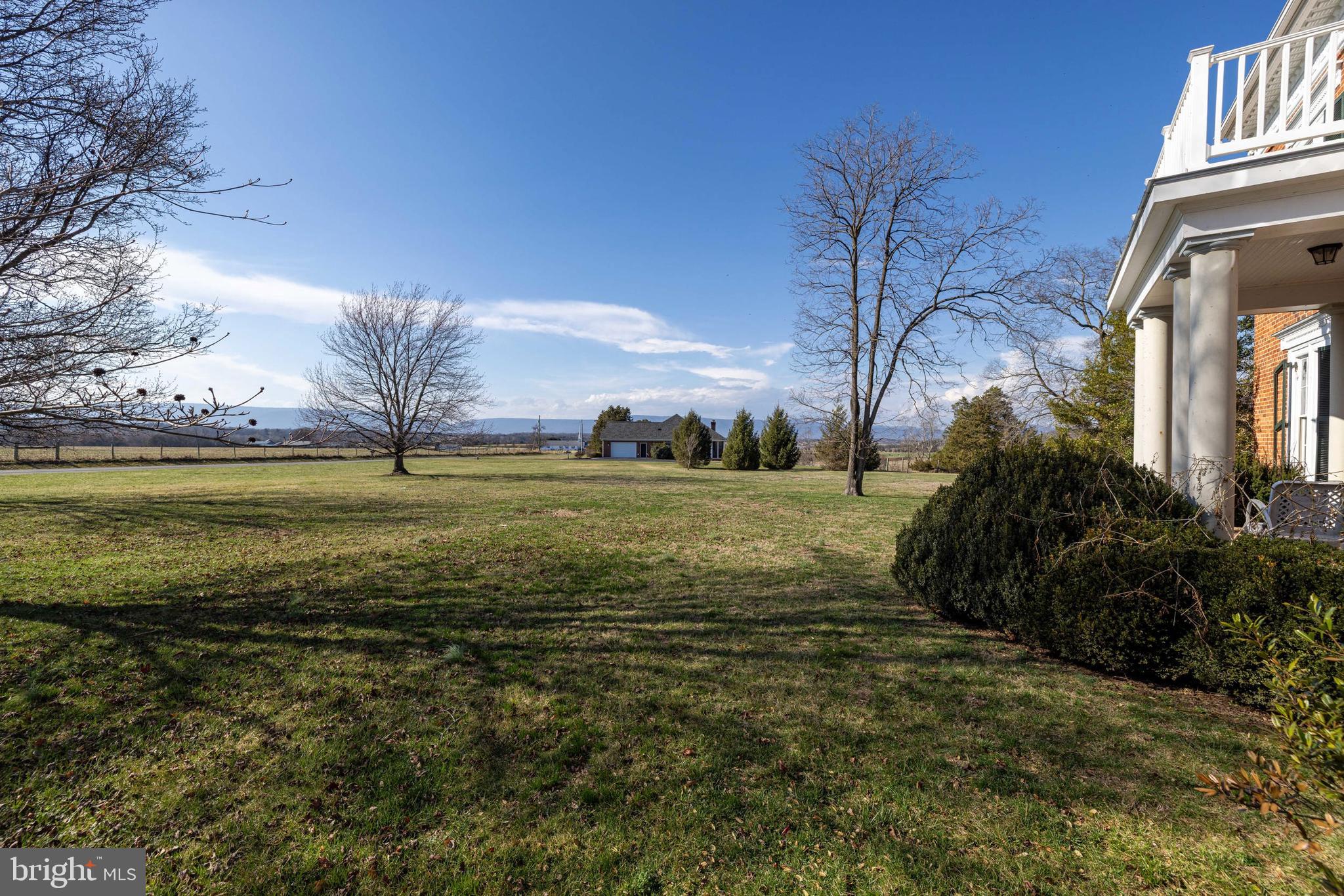 5329 Farmview Road Stanley, VA 22851 - Photo 66 of 111 a view of a large pool with lawn chairs under an umbrella