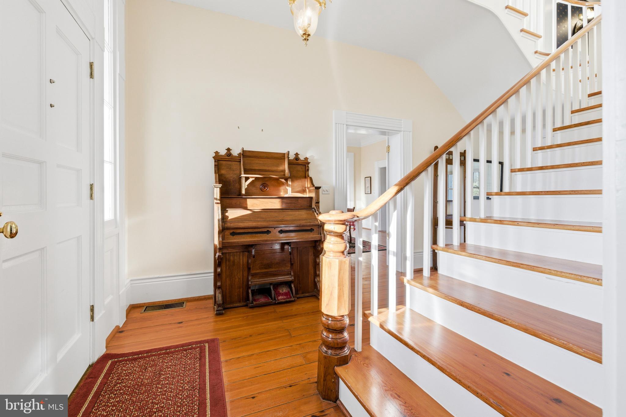 5329 Farmview Road Stanley, VA 22851 - Photo 8 of 111 a view of a livingroom with wooden floor and stairs