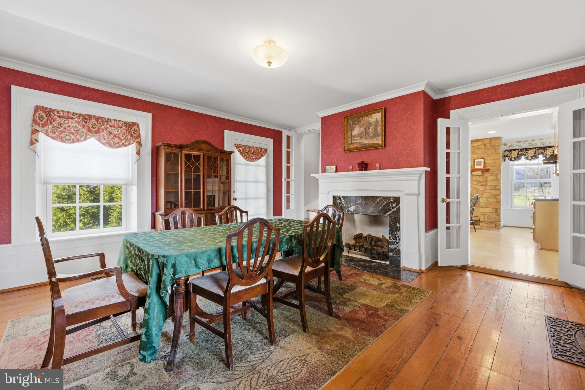 5329 Farmview Road Stanley, VA 22851 - Photo 10 of 111 a dining room with furniture a fireplace and wooden floor