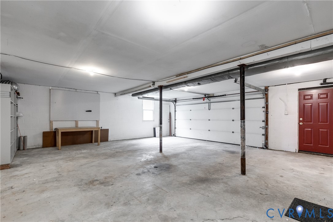 3924 Belspring Road Chester, VA 23831 - Photo 36 of 36 Spacious garage featuring concrete flooring, a lar