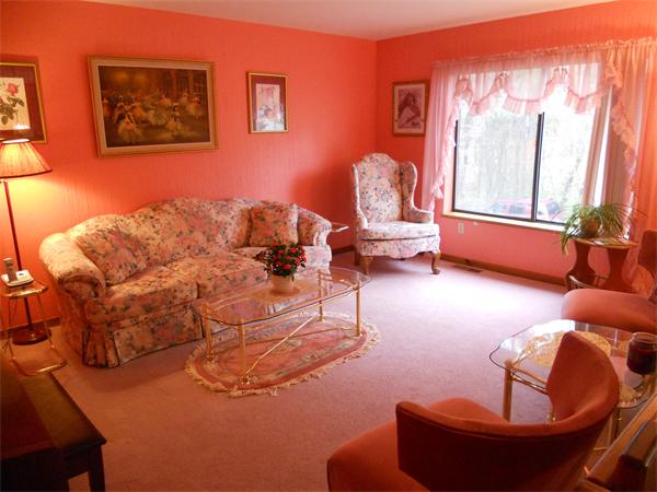 21 Ridgewood Drive, Unit 21 Atkinson, NH 03811 - Photo 2 of 13 a living room with furniture and a large window