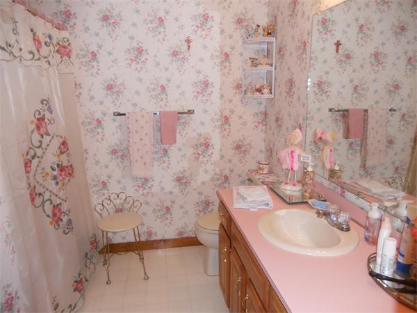 21 Ridgewood Drive, Unit 21 Atkinson, NH 03811 - Photo 7 of 13 a bathroom with a sink and a mirror