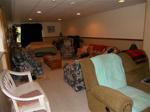 21 Ridgewood Drive, Unit 21 Atkinson, NH 03811 - Photo 8 of 13 a living room with furniture and a couch