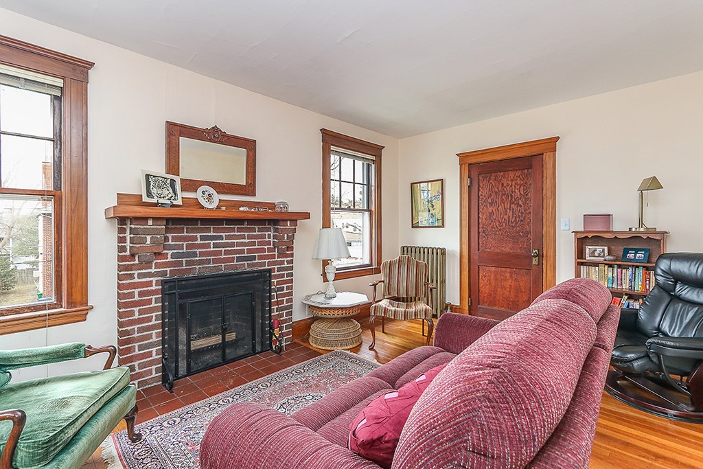 112-114 Adena Road, Unit 112 Newton, MA 02465 - Photo 8 of 16 a living room with furniture and a fireplace