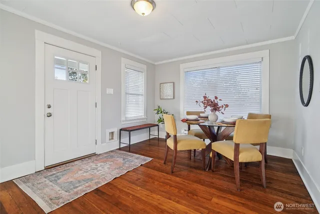 a view of a livingroom with furniture and wooden floor