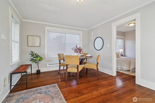 a view of a livingroom with furniture and hardwood floor