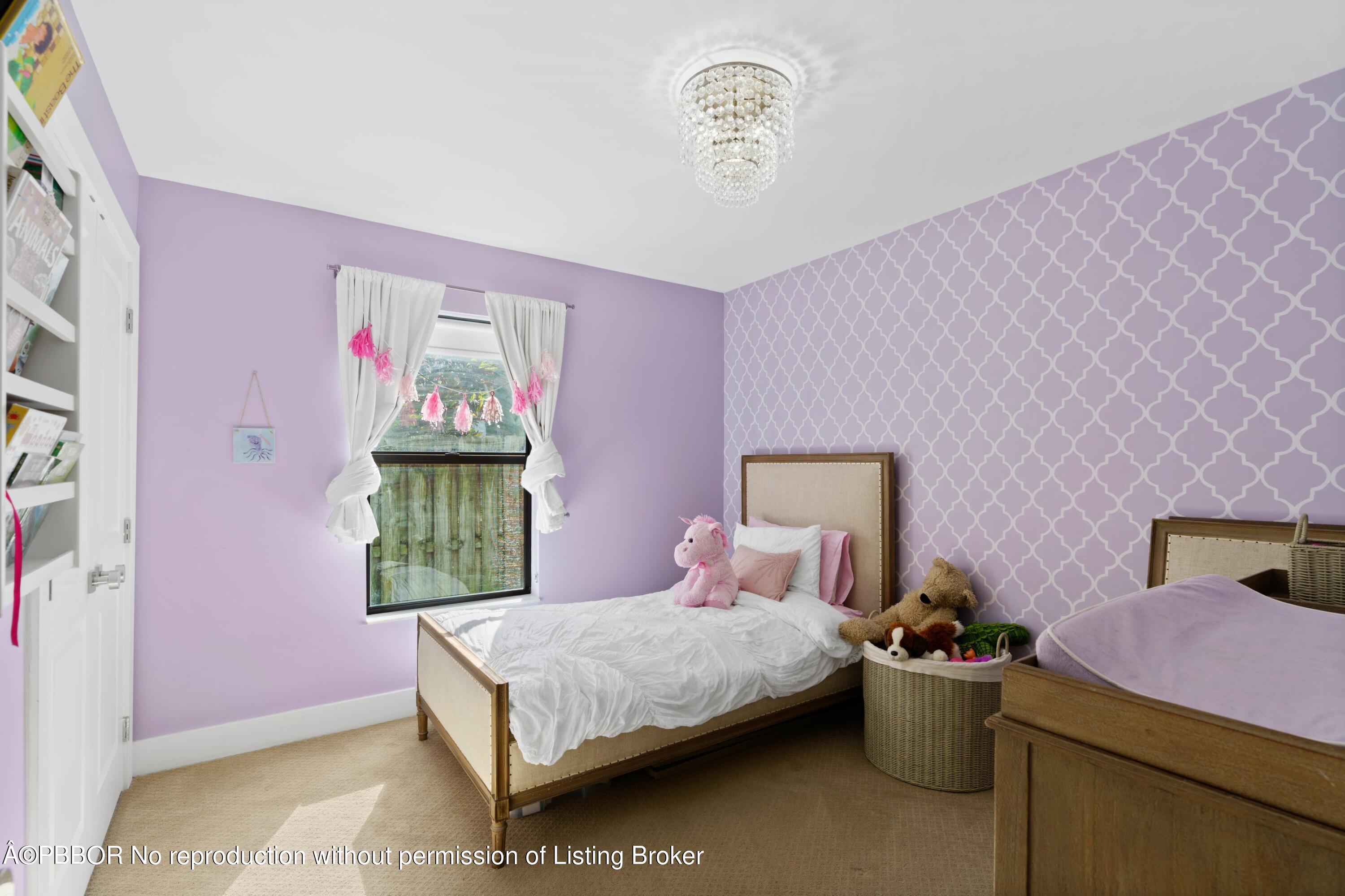 3210 Vincent Road West Palm Beach, FL 33405 - Photo 11 of 20 a bedroom with a bed and a potted plant