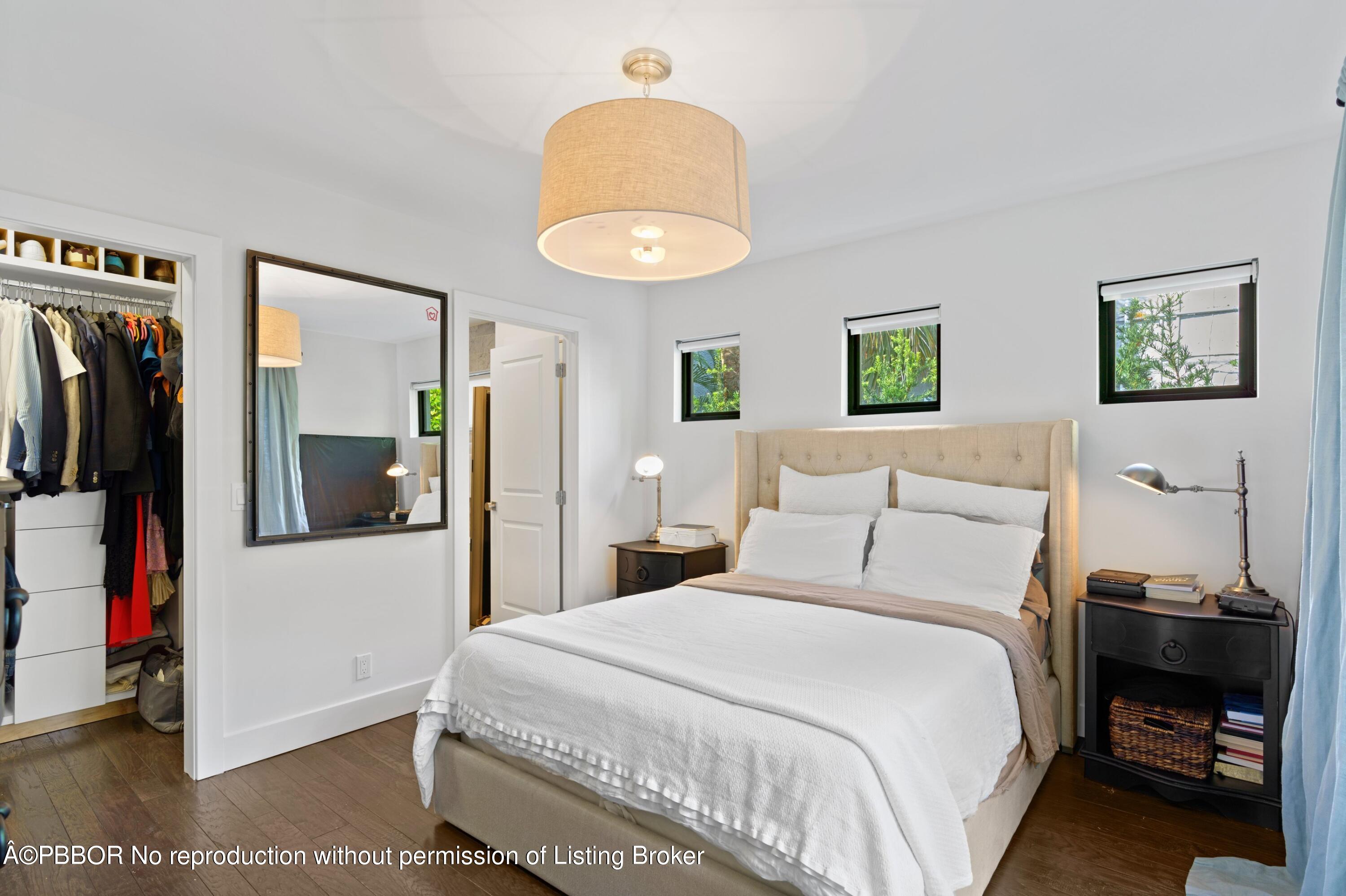 3210 Vincent Road West Palm Beach, FL 33405 - Photo 16 of 20 a bedroom with a bed and a mirror