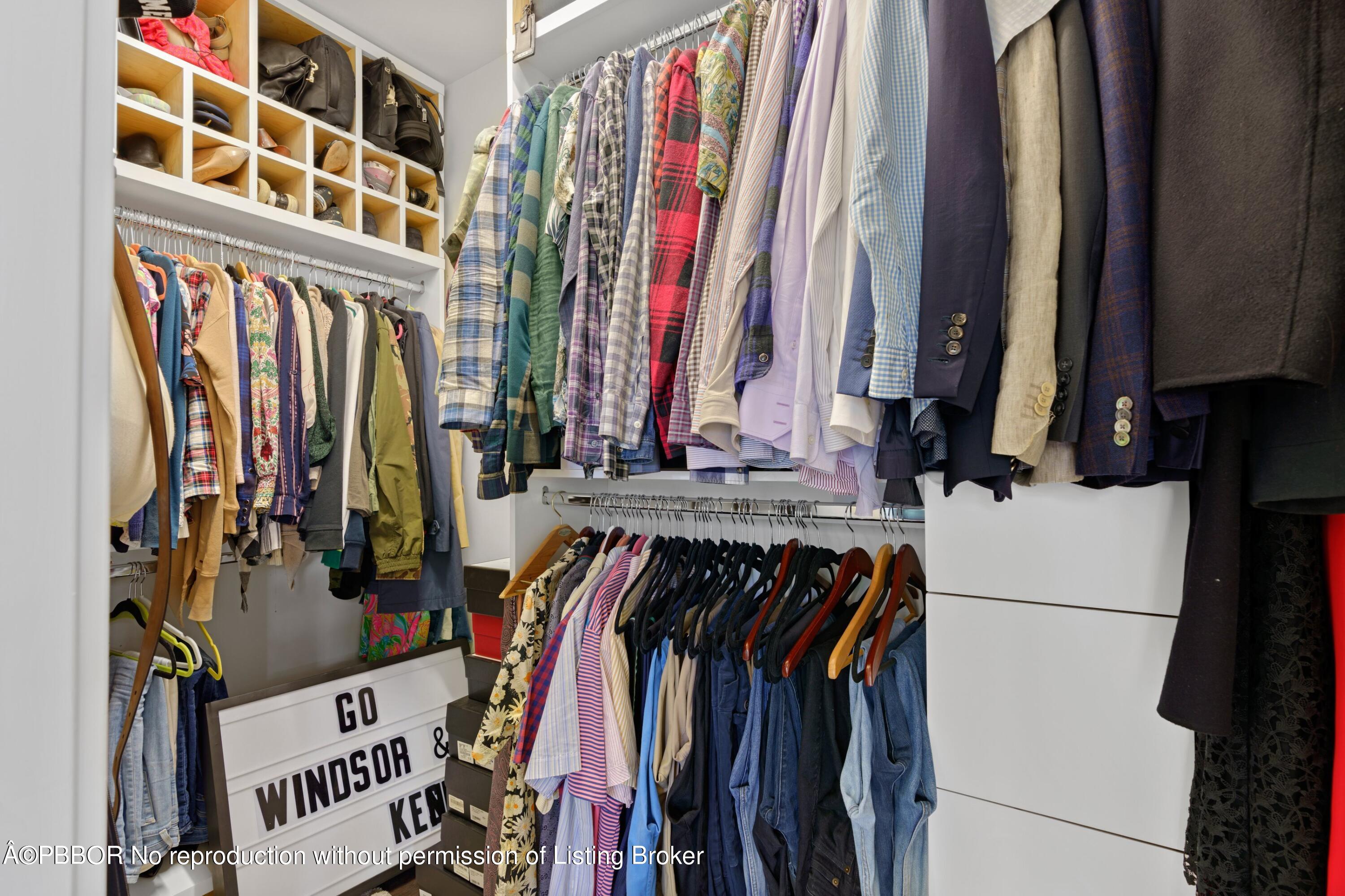 3210 Vincent Road West Palm Beach, FL 33405 - Photo 18 of 20 a view of walk in closet with clothes and shoes