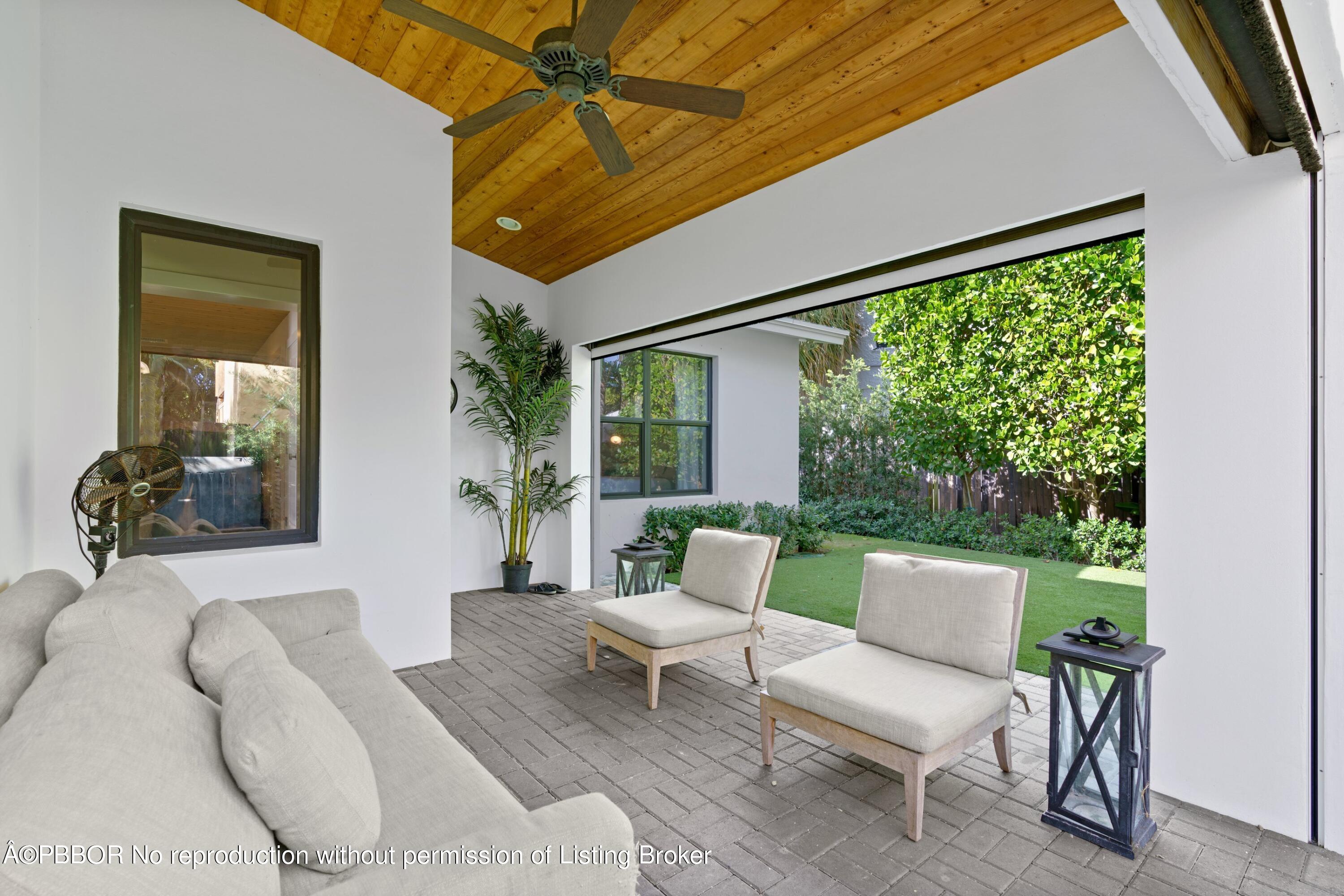 3210 Vincent Road West Palm Beach, FL 33405 - Photo 4 of 20 a living room with furniture and a large window