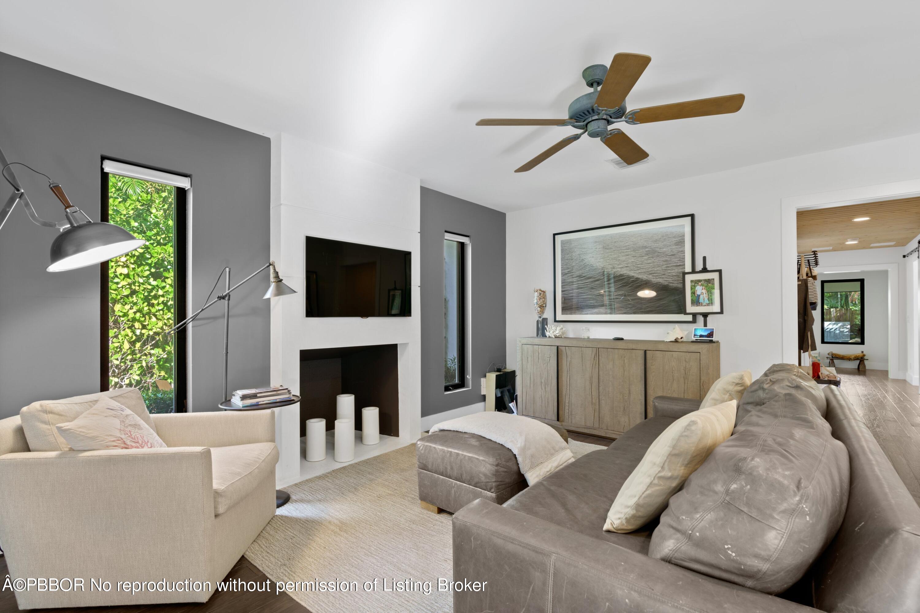 3210 Vincent Road West Palm Beach, FL 33405 - Photo 10 of 20 a living room with furniture and a fireplace