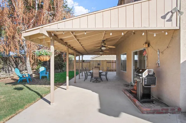 a view of a porch with chairs and couches