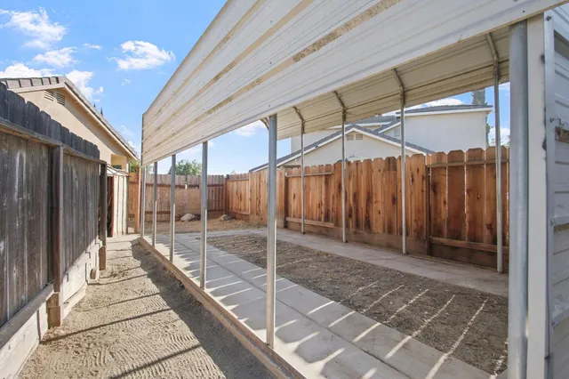 a porch with view of a house