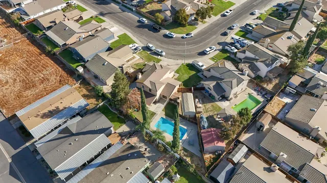aerial view of a house with outdoor seating