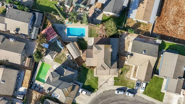 an aerial view of residential houses with outdoor space