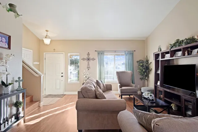 a living room with furniture and a flat screen tv