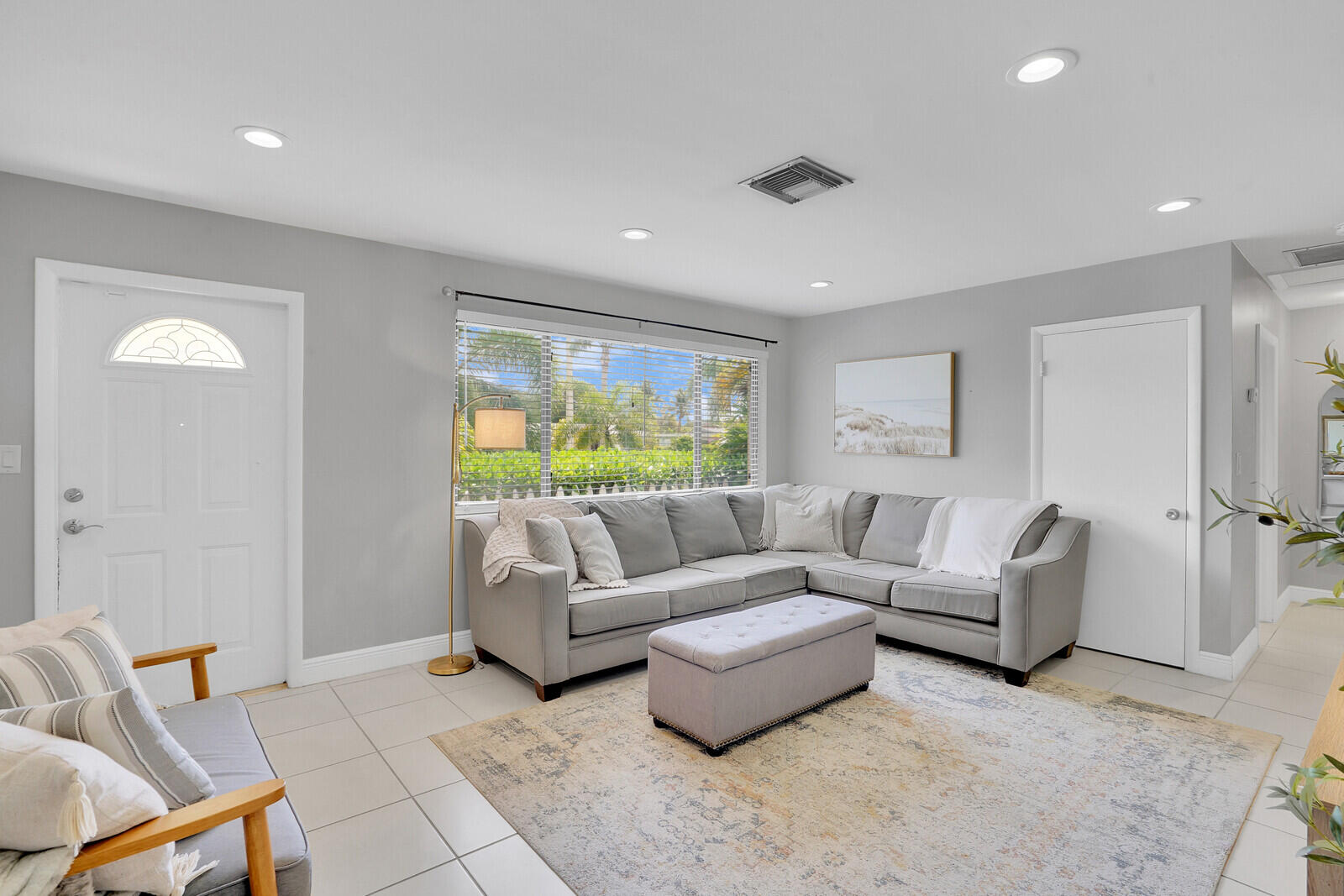 313 Davis Road Palm Springs, FL 33461 - Photo 9 of 39 a living room with furniture and a large window
