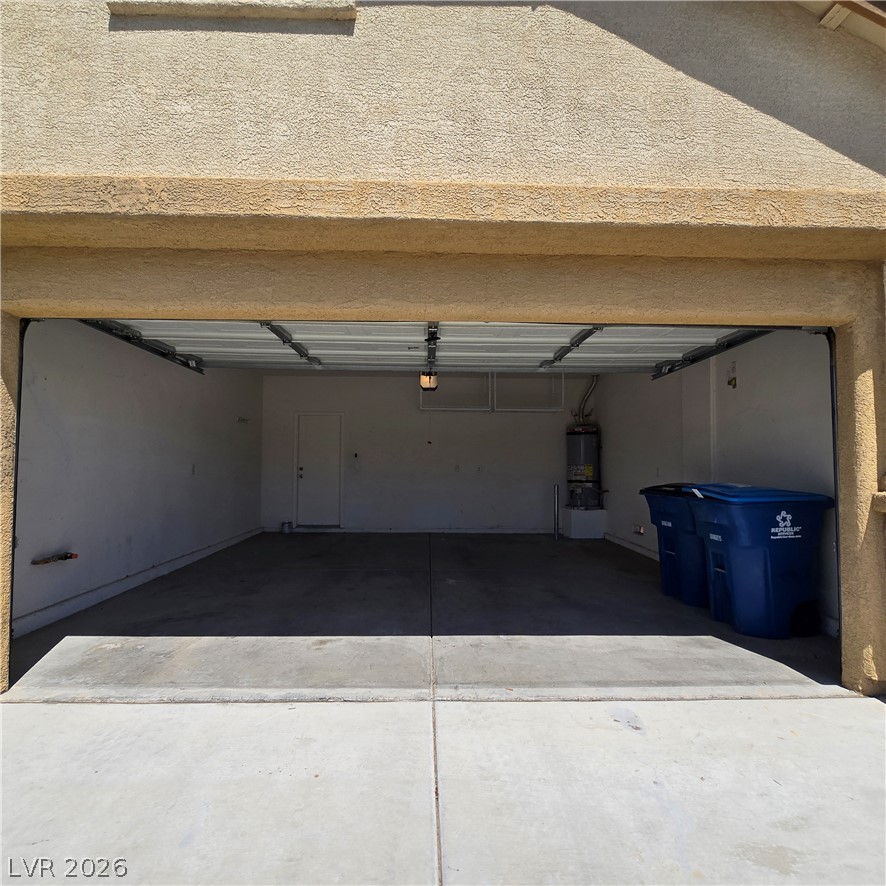9234 Kingston Road Henderson, NV 89074 - Photo 36 of 38 An accommodating garage, perfect for parking or additional storage, awaits.