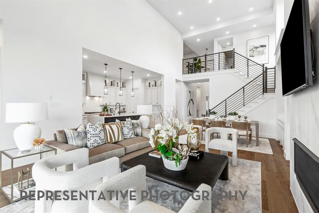 4415 Azalea Trail Oak Point, TX 75068 - Photo 11 of 38 a living room with furniture and a flat screen tv