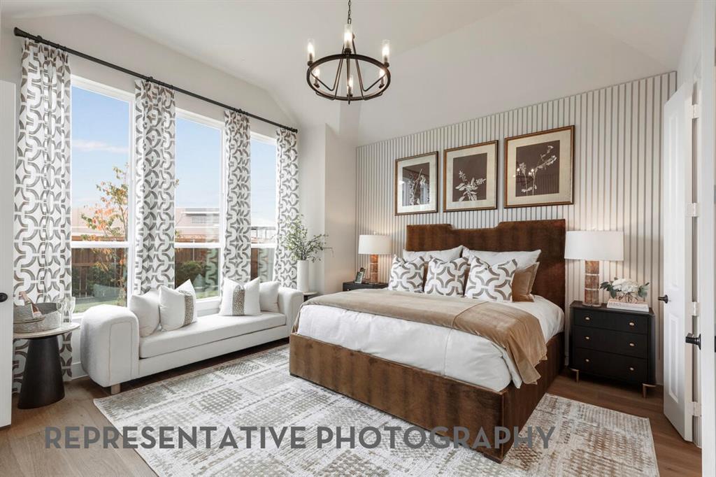 4415 Azalea Trail Oak Point, TX 75068 - Photo 12 of 38 a bedroom with a large bed and a couch